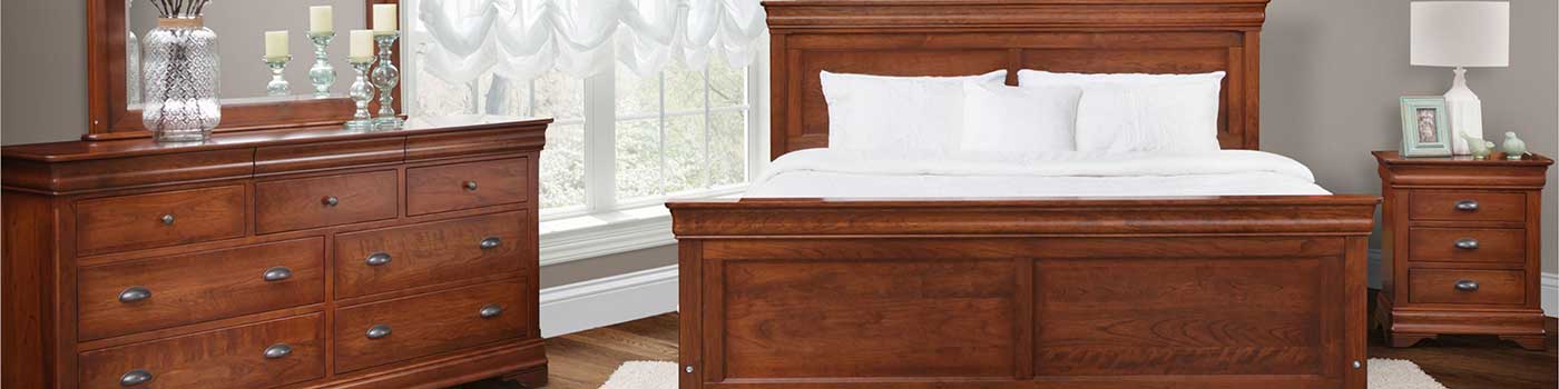 Classic hardwood bedroom furniture set. Dresser with mirror, bed with headboard, and night table. Made in Amish Country USA.