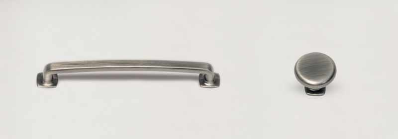 Nickel colored pull and round knob pull.