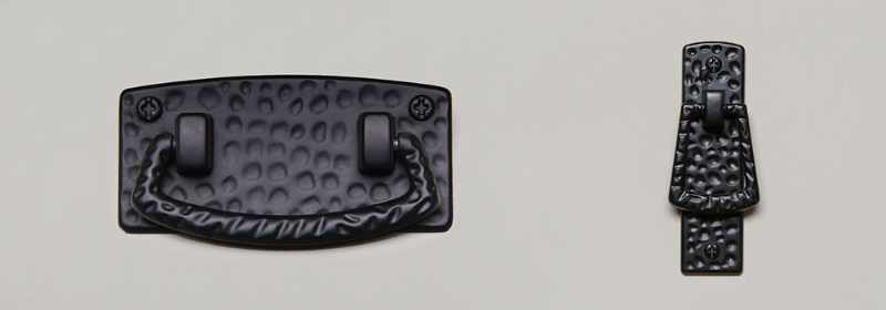 Hammered black metal door and drawer pulls.