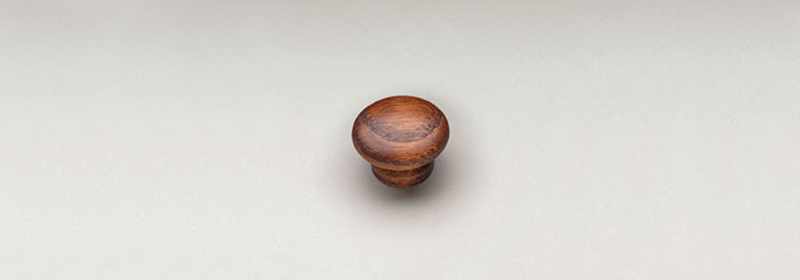 Hardwood knob for doors or drawers.