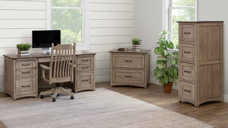 Home office with desk, chair, and filing cabinets, in ight color stain finish.