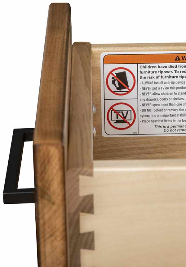 Open drawer showing safety labels on inside of drawer.