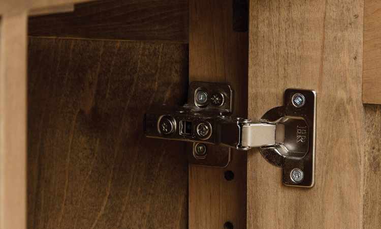 open door close-up view of door hinge from inside.