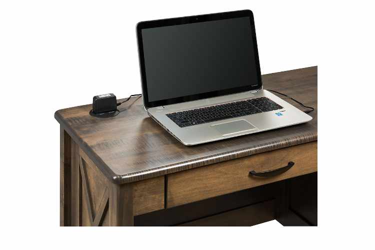 View of desk top with open laptop.
