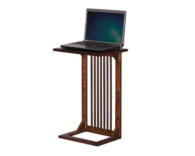 Open laptop on top of slide-over sofa table.