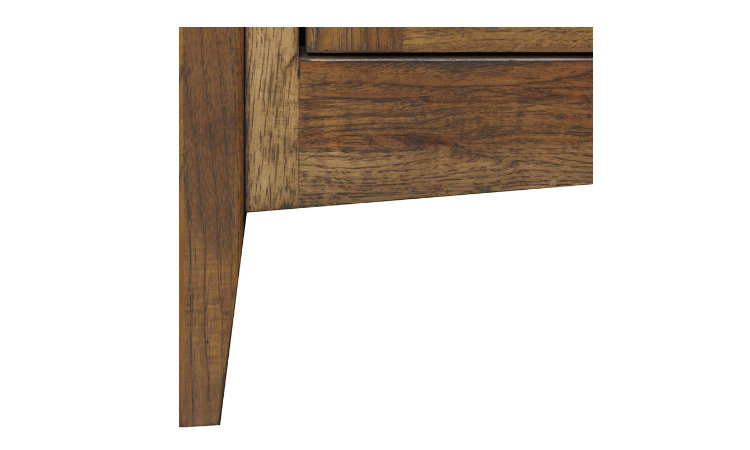 Tapered leg detail view of hardwood coffee table.