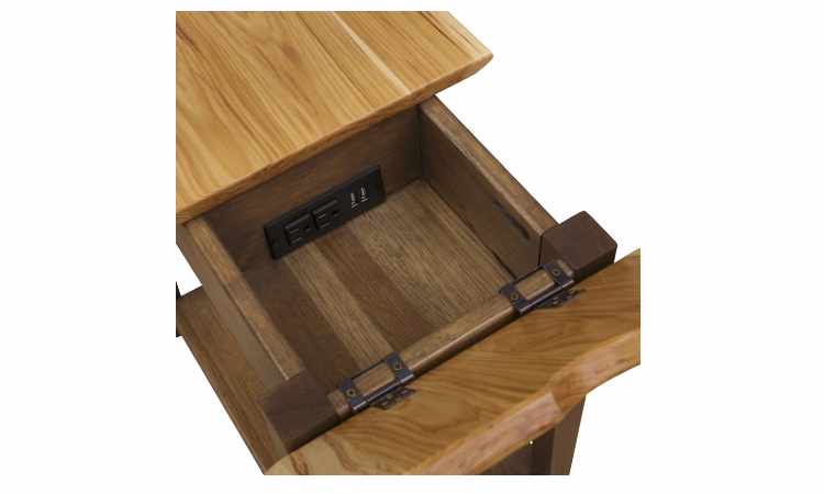 Detail view of table showing open compartment with built-in power port.
