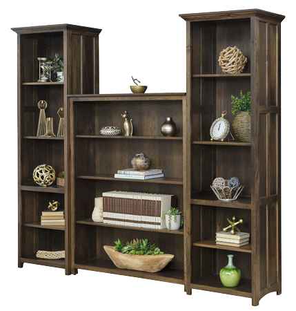 Wall unit bookcase staged with books and knick knacks.