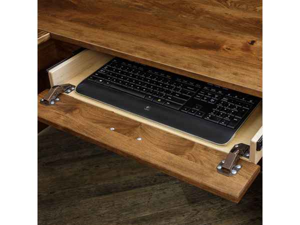 Closeup of open keyboard drawer with keyboard (not included).