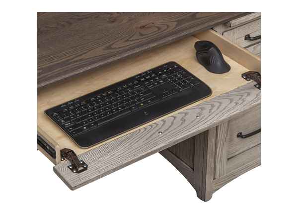 Closeup of open center drawer with keyboard and mouse (not included).