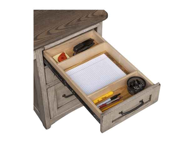 Closeup of open pencil drawer with 3 compartments.