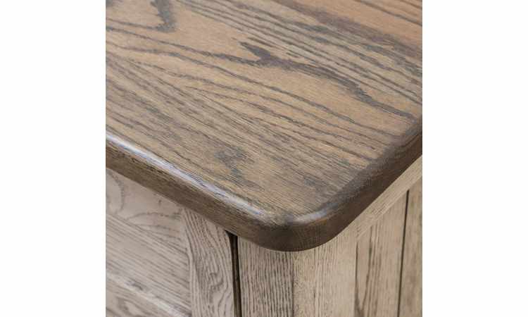 Closeup view of nightstand top with rounded corners.