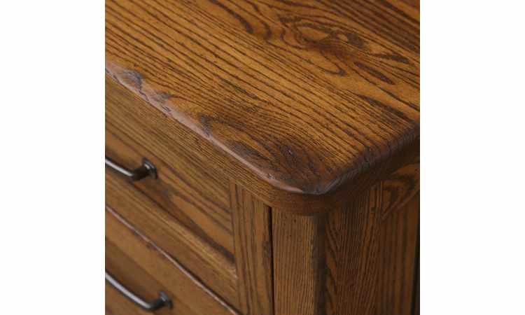 Closeup view of dresser top with rounded corners.