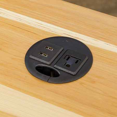 Closeup of power hub with 1 AC outlet and 2 USB ports.