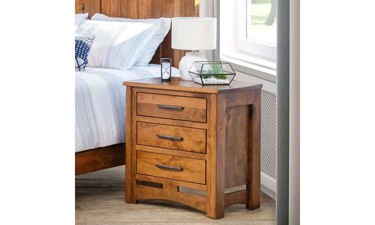 View of nightstand in bedroom setting, medium wood finish.
