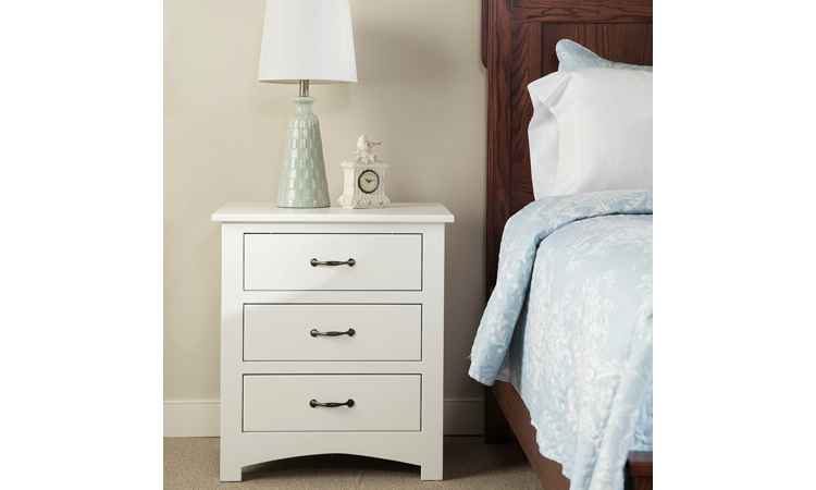 Nightstand in white paint finish, shown in bedroom setting.