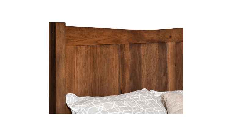 Closeup view of headboard with arched top.