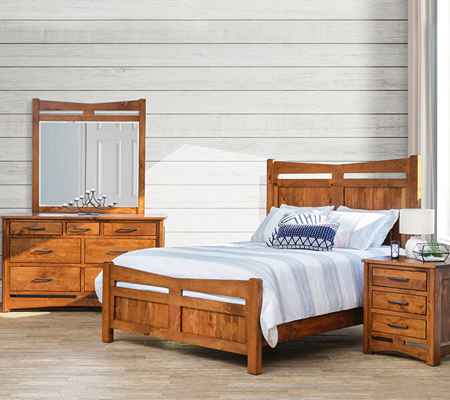 Queen size bed with tall headboard and foot board, nightstand, and dresser with mirror.