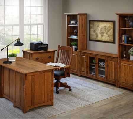 Home office with desk, chair on casters, printer stand and wall bookcase units.